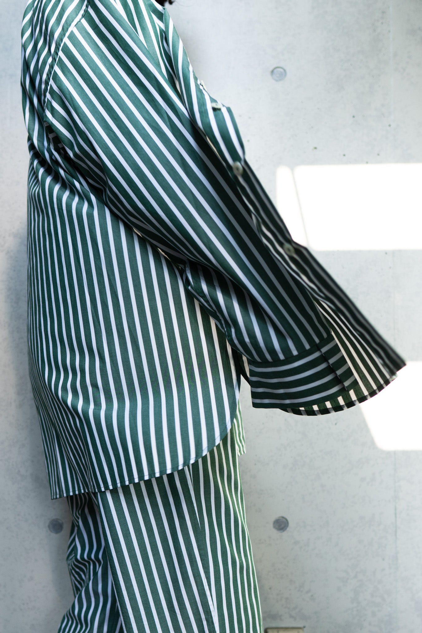 his shirt-green stripe